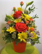 Orange_pot_with_roses_and_daisies.jpg