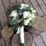 white_roses_and_sea_holly_bouquet.jpg